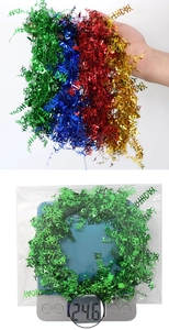 Détail de la guirlande métallique Happy Birthday colorée et du poids du colis