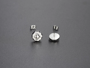 Detailed view of silver eagle studs in Harajuku style featuring bird motif and matte finish