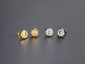 Detailed close-up of eagle embossed titanium steel studs in gold and silver finish