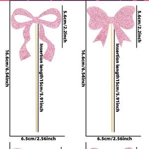 Pink glitter bow cupcake toppers with dimensions showing height and insertion length