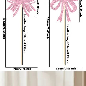 Size chart for pink glitter bow cake toppers showing 16.6cm and 16.4cm height dimensions