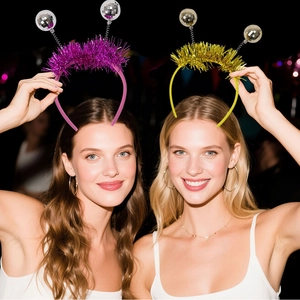 Close-up of disco party headbands featuring mini mirror balls and shiny tinsel on models