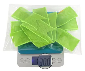 Close-up of a 30g bright green mesh ribbon bow in clear packaging for party DIY decor