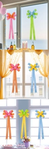 Close-up of multicolored linen bow ties with long ribbons for festive party decorations