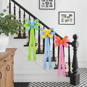 Close-up of decorative burlap-style bows on stairs for festive party decoration
