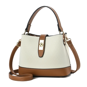 Minimalist bicolor bucket bag with weave texture and gold twist lock in cream and brown