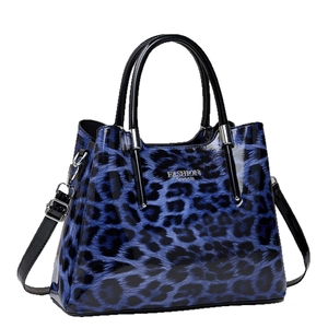 Fashionable leopard print bucket tote bag in glossy blue and black leather finish