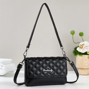 Elegant black quilted crossbody bag with chain strap and silver logo for women