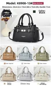Detail of lychee pattern leather handbag showing metal lock and 11cm handle height