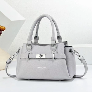 Light gray lychee leather handbag with silver hardware and adjustable shoulder strap