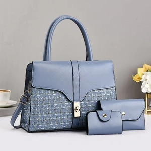 Three-piece vintage blue leather tote set with woven texture and gold hardware details