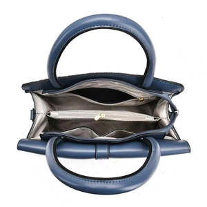 Internal view of navy blue leather tote bag showing multi-layered compartments and lining