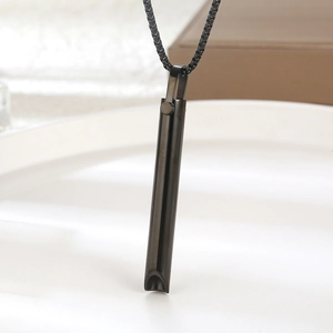 Collar cilíndrico de acero inoxidable negro para respiración consciente en plato