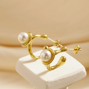 Elegant gold C-shaped pearl stud earrings crafted in polished stainless steel for women