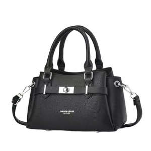 Elegant black lychee leather handbag with vintage doctor bag silhouette and silver hardware