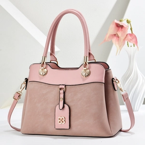 Elegant pink corduroy tote bag for women with clover charm and adjustable strap