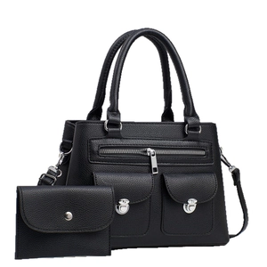 Black pebbled leather tote bag set with detachable strap and matching envelope wallet