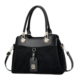 Black corduroy and leather patchwork tote bag with gold clover charm and shoulder strap