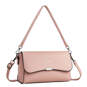 Minimalist pink pebble leather crossbody bag with silver buckle and flap closure