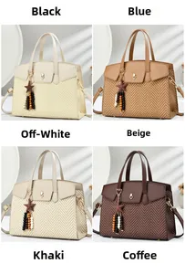 Detail view of four textured crossbody bags with heart clasp and star tassel charms