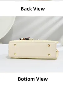 Close-up of beige woven handbag showing durable leather base and gold metal protective feet
