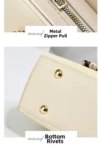 Macro detail of high-quality gold hardware zipper and bottom studs on the beige tote bag