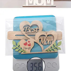 Detailed view showing a 35.6g wooden heart gift for Mom on a digital weighing scale
