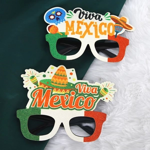 Detail of Viva Mexico party glasses with colorful glitter and traditional folk motifs