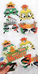 Detail of Mexico party glasses with glitter cactus, sombrero, and flag designs