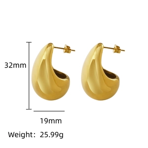 Detail view of large teardrop earrings in polished gold showing 32mm height and 19mm width