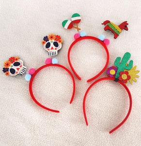 Detail of festive Cinco de Mayo headbands featuring skulls, pinatas and maracas icons