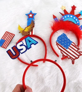 Detail of four patriotic Fourth of July headbands with USA lettering and star patterns