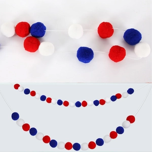 Detail of red white and blue pom pom garland for patriotic party decoration