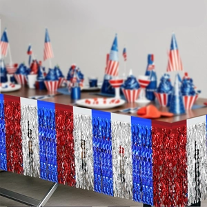 Macro detail of red white and blue metallic fringe table skirt for Independence Day party