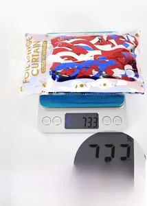 Detailed scale view of red white and blue foil fringe curtain party decoration weighing 73.3g