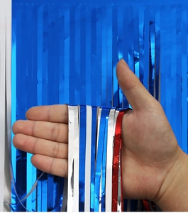 Detail of red white and blue metallic foil fringe table skirt for Independence Day party