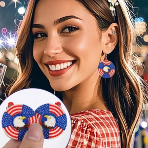 Detail of USA eagle and flag earrings with sparkling acrylic texture and bokeh background