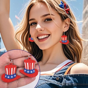 Close-up of Uncle Sam hat earrings with American flag colors and glittering stars