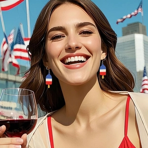 Detail of popsicle star-spangled earrings worn by a smiling model at a festive party