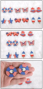 Detailed view of six pairs of July 4th earrings featuring stars and stripes designs