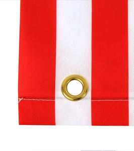 Close-up of July 4th banner showing red white stripes and durable brass grommet detail