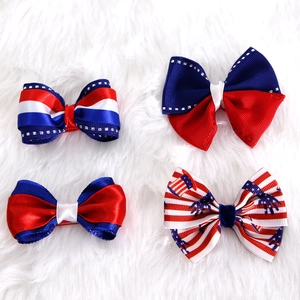 Set of four American flag hair bows with patriotic stars and stripes for holiday parties