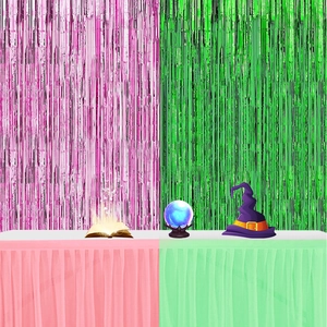 Pink and green fringe curtain backdrop with matching table skirt for party decor