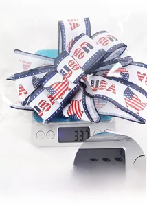 Detailed view of USA flag bow ornament being weighed at 33.7g on a digital scale