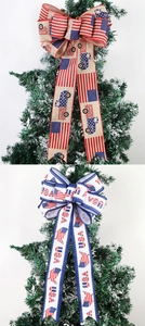 Detail of burlap American flag bows with stars and USA motifs on a holiday tree