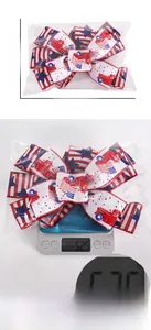 Detail view of Independence Day bow showing 30x22cm dimensions and 52.5g weight