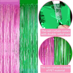 Pink and green fringe curtain backdrop for Wicked theme parties with adhesive top
