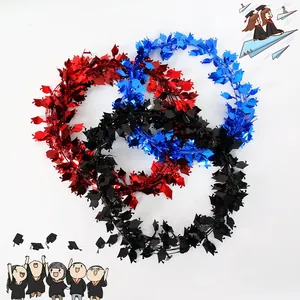 Detail of graduation party tinsel garlands with mini doctoral caps in red, blue, and black