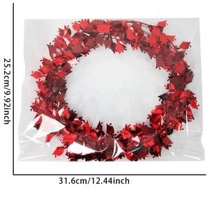 Red graduation tinsel garland with mini mortarboard caps in package measuring 25x31cm