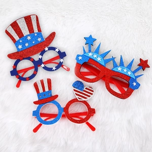 Independence Day party glasses set with glitter stars and stripes on white fur background